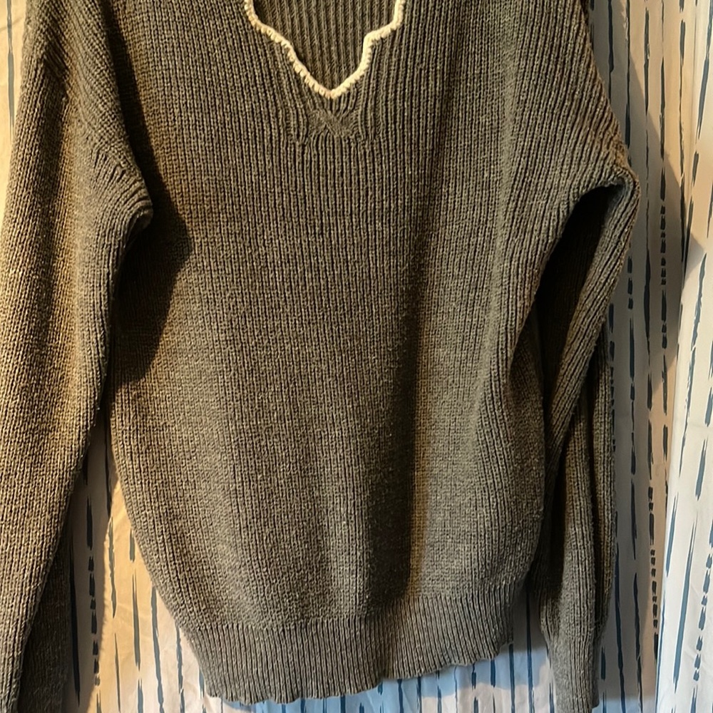 So soft sweater. Grey with white scalloped neck line. Measurements I’m pictures.